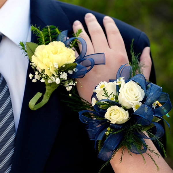matching boutonniere and wrist corsage